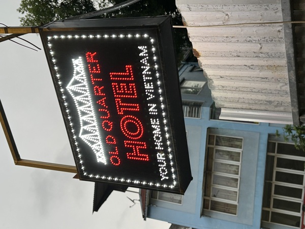 Sign of the Old Quarter Hotel above the entrance of the hotel